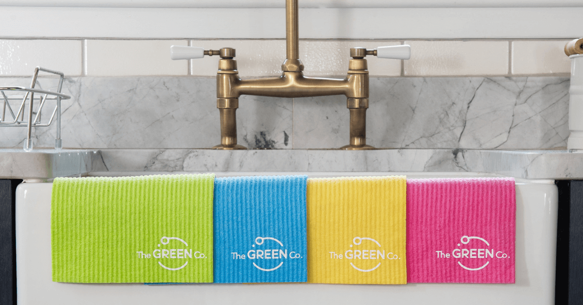 cellulose dish cloths on sink ready to clean chrome taps and sink