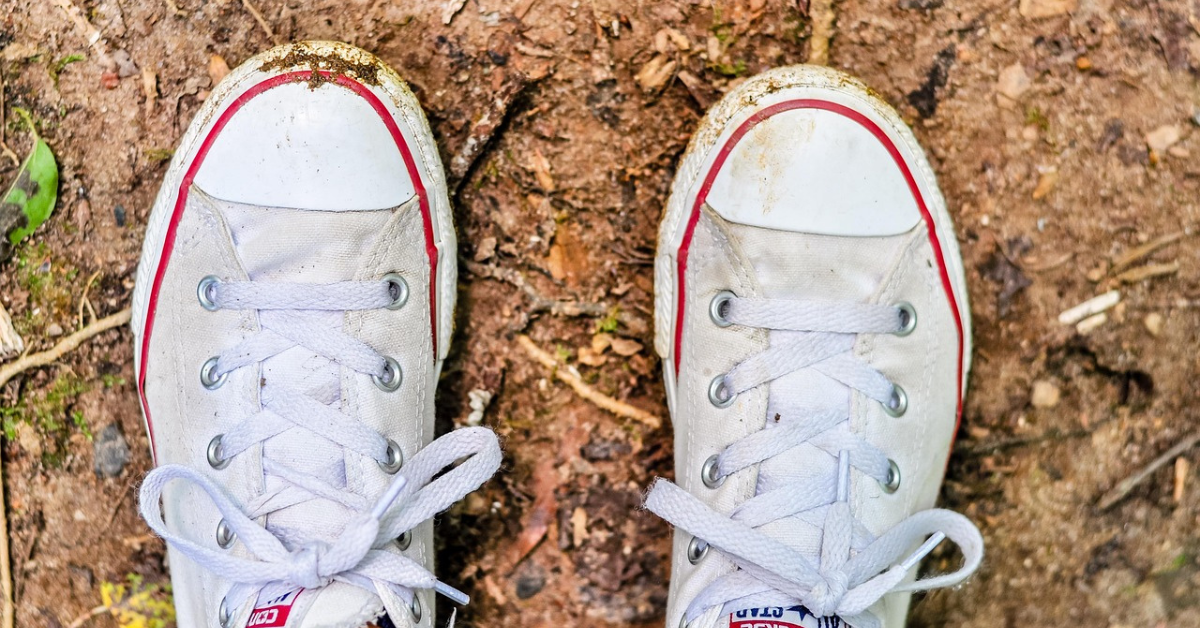 dirty trainers before being placed in a washing machine safely to be cleaned with greensheets™