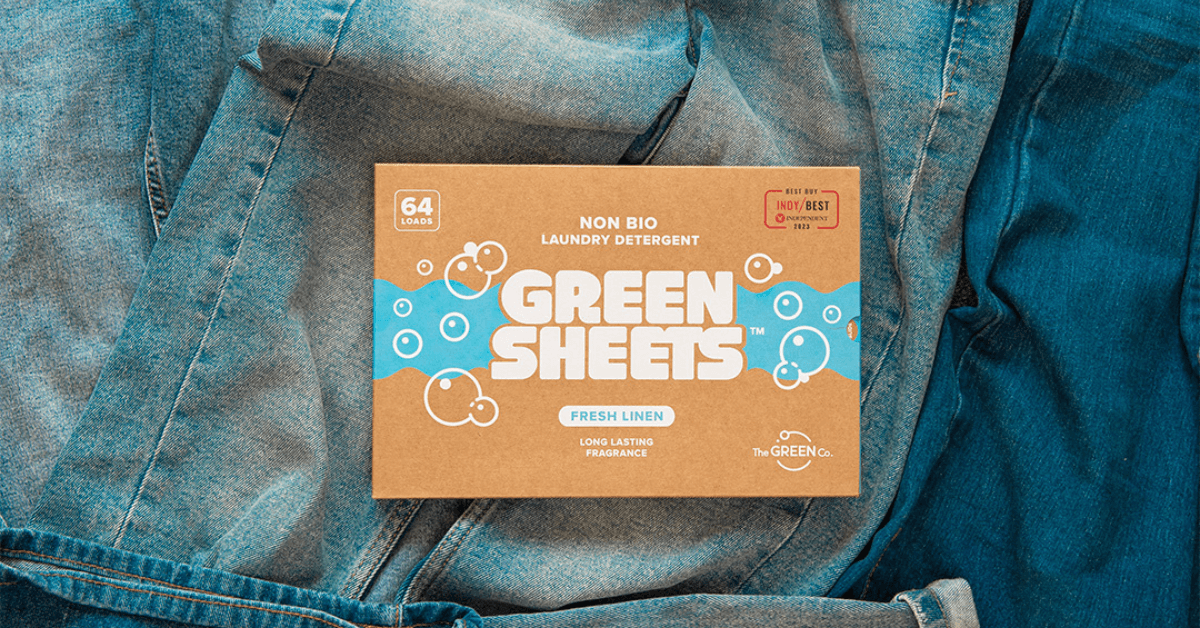 eco friendly laundry detergent sheets on a pile of denim