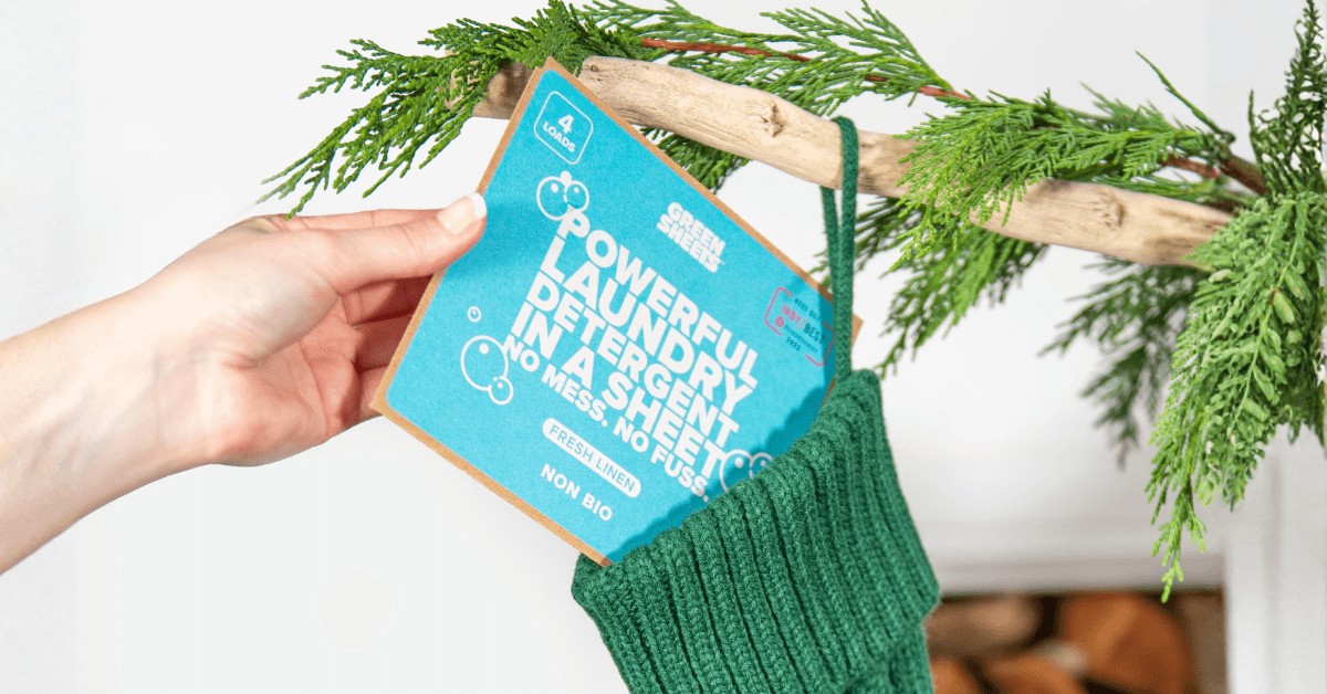 fresh linen laundry detergent greensheets sample being placed into christmas stocking