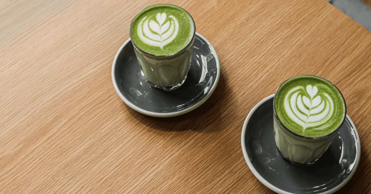 matcha drinks in mugs on coffee table