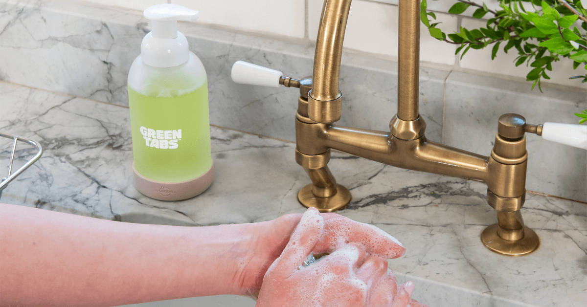washing hands with foam soap refill from hand soap greentabs™ glass bottle
